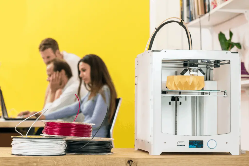 3D printer on table with filament