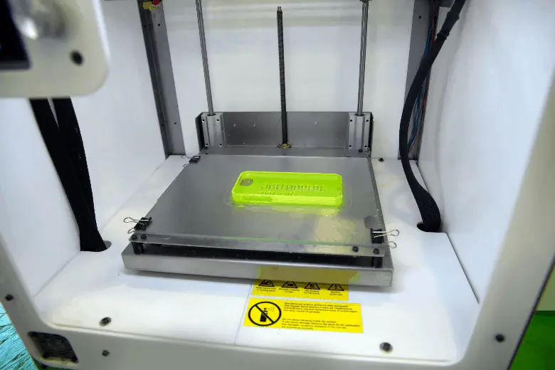 3d printed green phone case inside printer